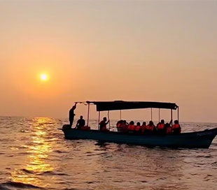 Romantic Sunset Boat Ride in Pondicherry with RV Boating Adventure, capturing the golden hues over the tranquil waters.